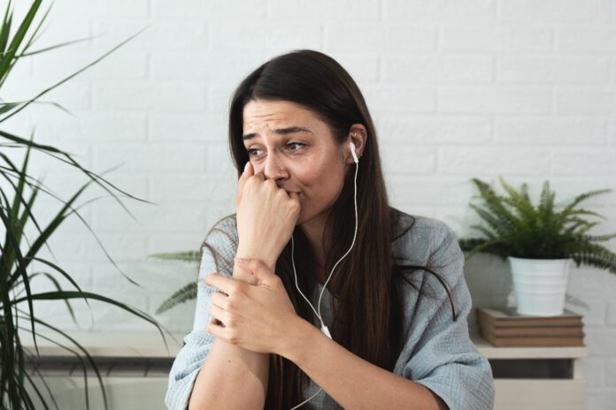 Woman in online therapy session.